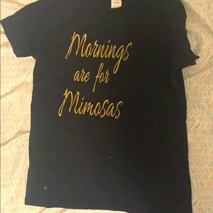 It’s a black shirt with gold words